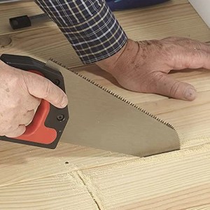 man using a floorboard saw