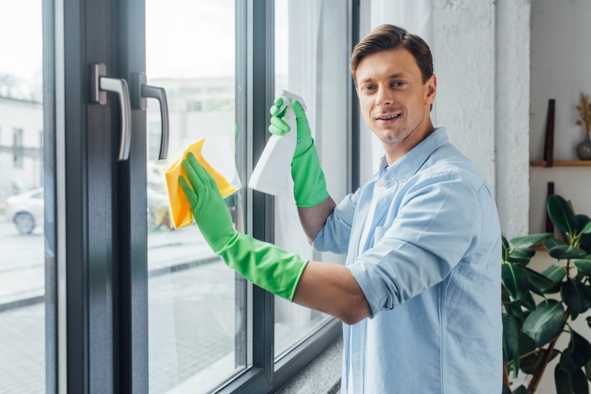 A person cleaning the windows