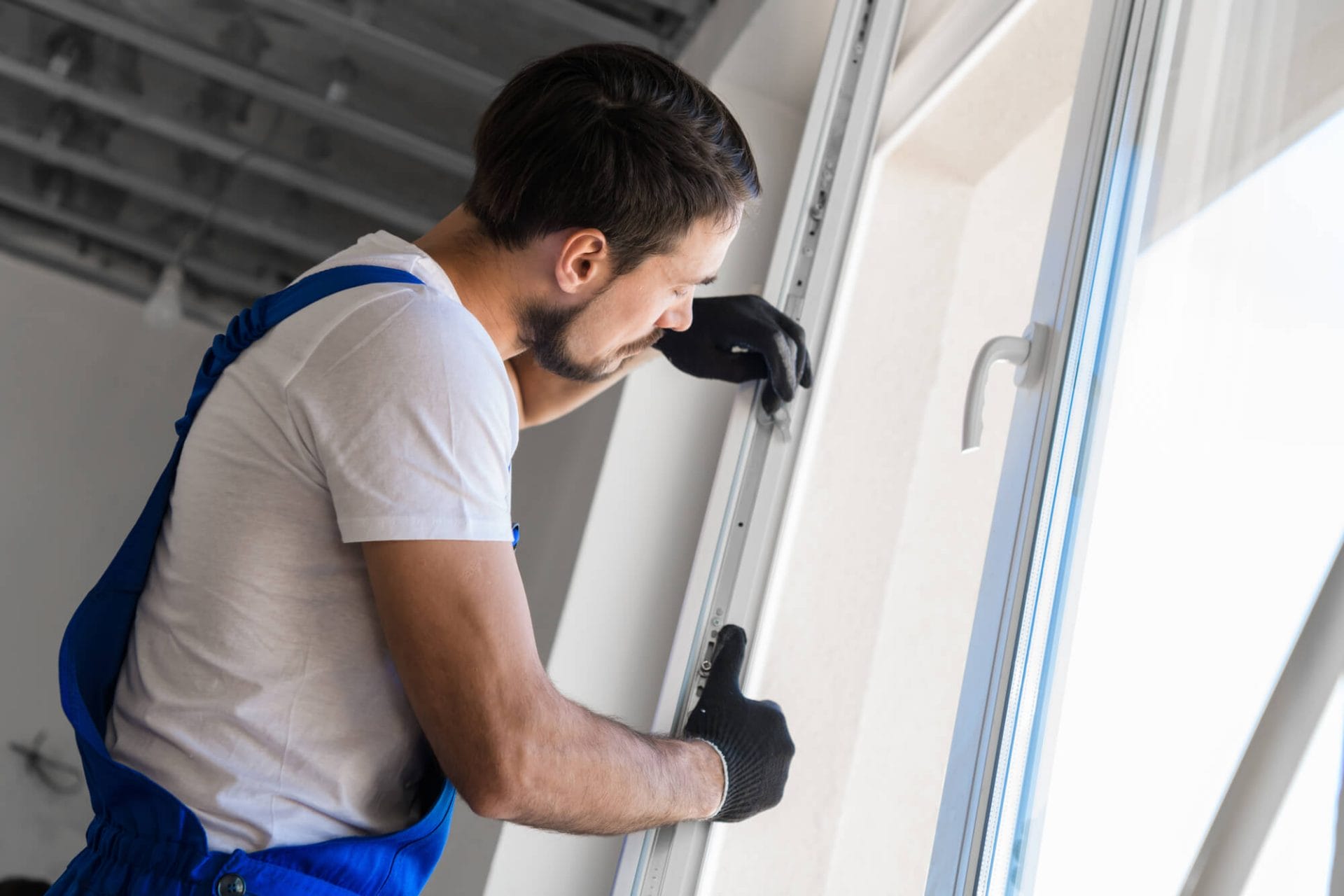 A professional inspecting a window