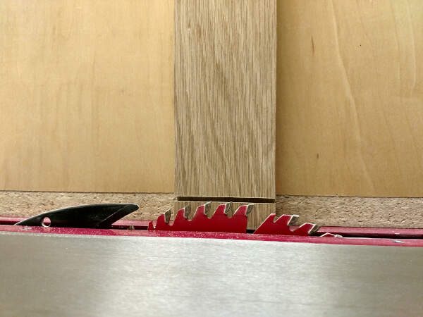 adjusting blade height to match tongue shoulder for cabinet doors