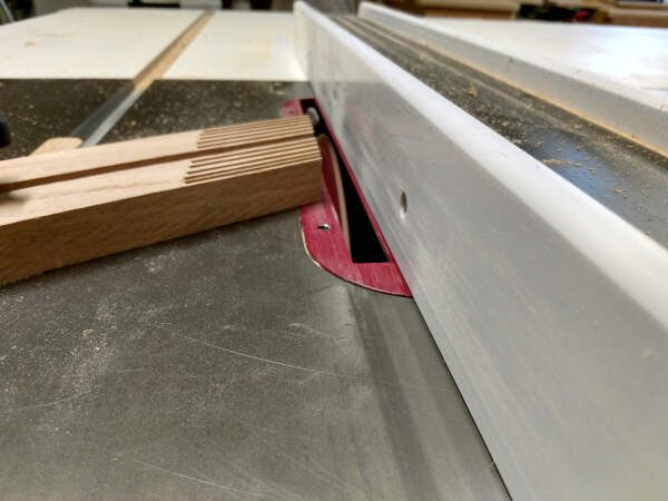 using a feather board to cut grooves