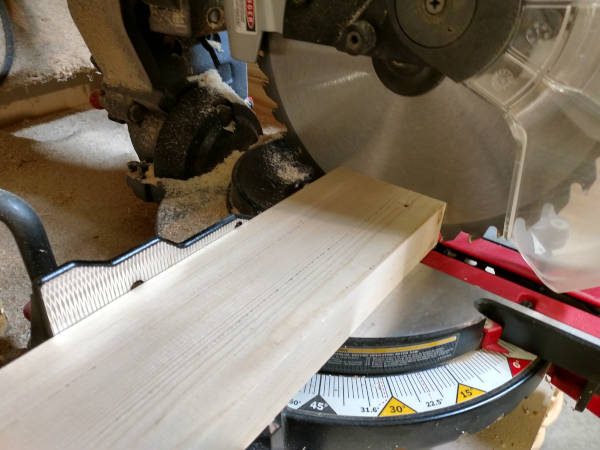 cross cutting board to square it up with miter saw