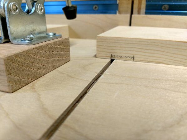 Lining up a dado cut for the back of the dovetail drawer box